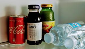 two bottles of coca cola and a can in a refrigerator at LaGare in Neive +9 photos