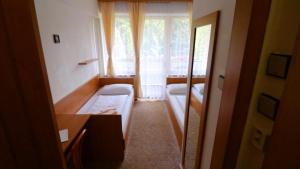 Posteľ alebo postele v izbe v ubytovaní Horský Hotel Neptun