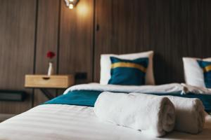 Voodi või voodid majutusasutuse Tulip Residence & Spa Hotel toas