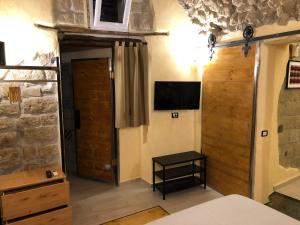 TV a/nebo společenská místnost v ubytování Donna Margherita Appartamento
