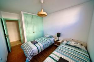A bed or beds in a room at Arena Blanca