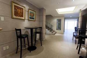 Uma área de estar em Argentino Hotel