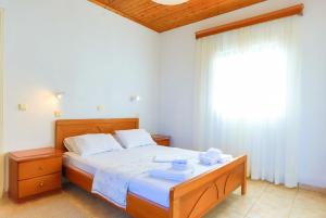 Ένα ή περισσότερα κρεβάτια σε δωμάτιο στο Villa Meropi +44 φωτογραφίες