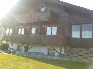 a large wooden house with a large deck at Haus Melanie in Hohenau