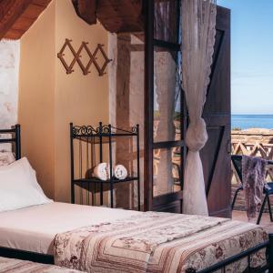 A bed or beds in a room at Alegria Villas Complex