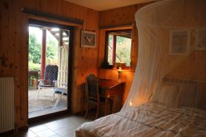 Katil atau katil-katil dalam bilik di Gesves Côté Jardin