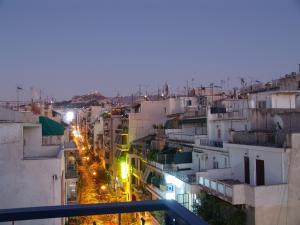 a view of a city street at night at Hotel Cosmos in Athens