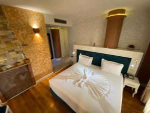Ліжко або ліжка в номері The Red Bricks Hotel