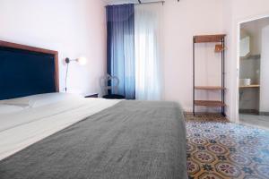 Postel nebo postele na pokoji v ubytování Carrara Bella