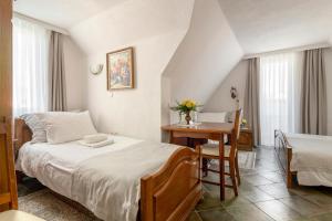 Postel nebo postele na pokoji v ubytování Jagodic Garni Hotel