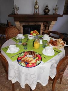a table with a plate of food on it at Villa les Bisets 497 rue de fenelon in Carlux