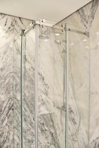 a shower with a glass door in a bathroom at A Rendilheira Boutique Hotel in Vila do Conde +33 photos