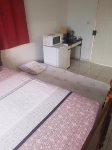 Una cama o camas en una habitación de MANIKOU