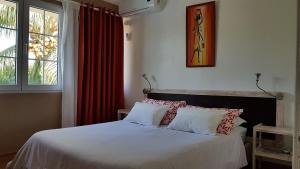 Postel nebo postele na pokoji v ubytování Tamarin Loft Apartment
