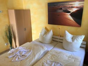 Ένα ή περισσότερα κρεβάτια σε δωμάτιο στο Haus Seestern mit Strandkorb inkl