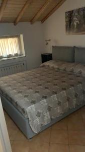 A bed or beds in a room at Rooms Teatro Greco