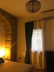 A bed or beds in a room at Eufemia27