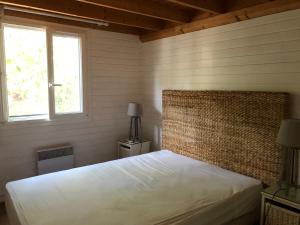 Postel nebo postele na pokoji v ubytování Saint tropez -parc oasis