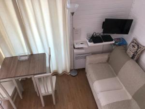 TV a/nebo společenská místnost v ubytování Saint tropez -parc oasis