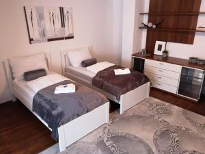Postel nebo postele na pokoji v ubytování Alps Apartment