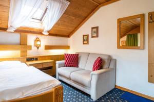 Postel nebo postele na pokoji v ubytování Hotel Alpina