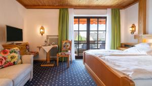 Postel nebo postele na pokoji v ubytování Hotel Alpina
