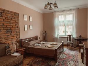 Llit o llits en una habitació de Kurnakh Apartment