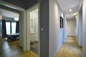 a hallway with a room with a bed and a bathroom at Apartment Vanilla I with beautiful Seaview in Rabac +23 photos