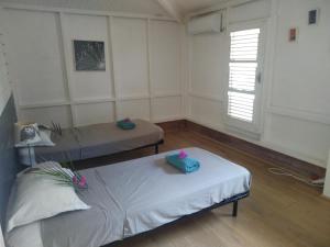 Tartane Grand Appartement Vue Mer 객실 침대