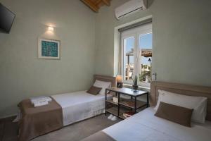 Posteľ alebo postele v izbe v ubytovaní Villa Roxanne + 30 fotografií