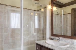 a bathroom with a sink and a shower at Casa Banhs de Tredòs by Totiaran in Tredós