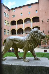 a statue of a lion in front of a building at Attic one bedroom flat in Old Town Lyon in Lyon