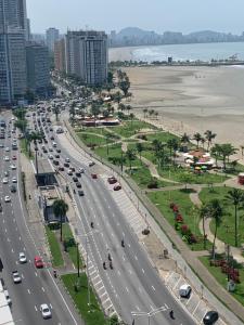 a busy highway in a city with cars on it at São Vicente Itararé prédio frente mar apto fundo vista parcial in São Vicente