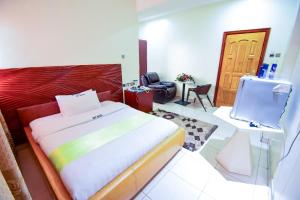 Postel nebo postele na pokoji v ubytování Hotel OK Kampala