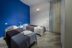 Posteľ alebo postele v izbe v ubytovaní Villa Rosaria vicino la Riserva dello Zingaro