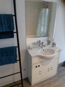 a bathroom with a sink and a mirror at Repaire des Corsaires Normands in Le Tréport +35 photos
