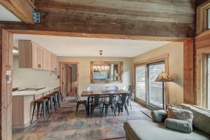 a kitchen and living room with a table and chairs at An203 Anaconda Condo in Copper Mountain