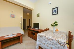 A bed or beds in a room at Apartments Kolt - 15m from sea