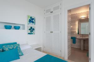 Postel nebo postele na pokoji v ubytování Villa Paraiso D14