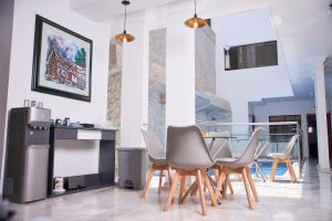 TV a/nebo společenská místnost v ubytování Casa Esmeralda Hotel Boutique