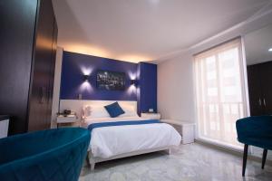 Postel nebo postele na pokoji v ubytování Casa Esmeralda Hotel Boutique