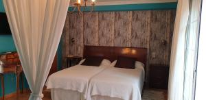Postel nebo postele na pokoji v ubytování Hotel Iris La Eliana