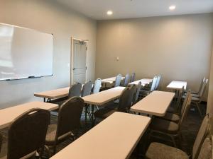 a classroom with tables and chairs and a whiteboard at Holiday Inn Express - Grand Island by IHG in Niagara Falls