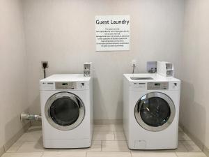 two washing machines and a washer and dryer in a room at Holiday Inn Express - Grand Island by IHG in Niagara Falls
