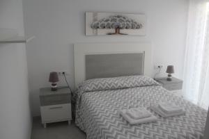 Postel nebo postele na pokoji v ubytování Apartamento Iceberg Tarifa Parking gratuito