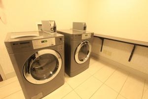 a washing machine and a dryer in a laundry room at Holiday Inn Express & Suites Chattanooga-Hixson, an IHG Hotel in Hixson