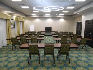 a classroom with tables and chairs in a room at Holiday Inn Express & Suites Houston Northwest-Brookhollow by IHG in Houston +48 photos