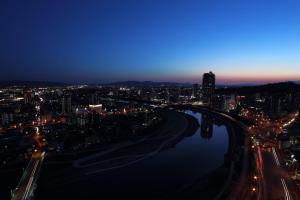 a view of a city at night at ANA Crowne Plaza Kumamoto New Sky, an IHG Hotel in Kumamoto