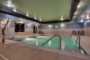a pool in a building with a large pool at Holiday Inn Express - Lexington East - Winchester, an IHG Hotel in Winchester