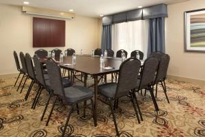a conference room with a long table and chairs at Holiday Inn Express Berea by IHG in Berea +19 photos